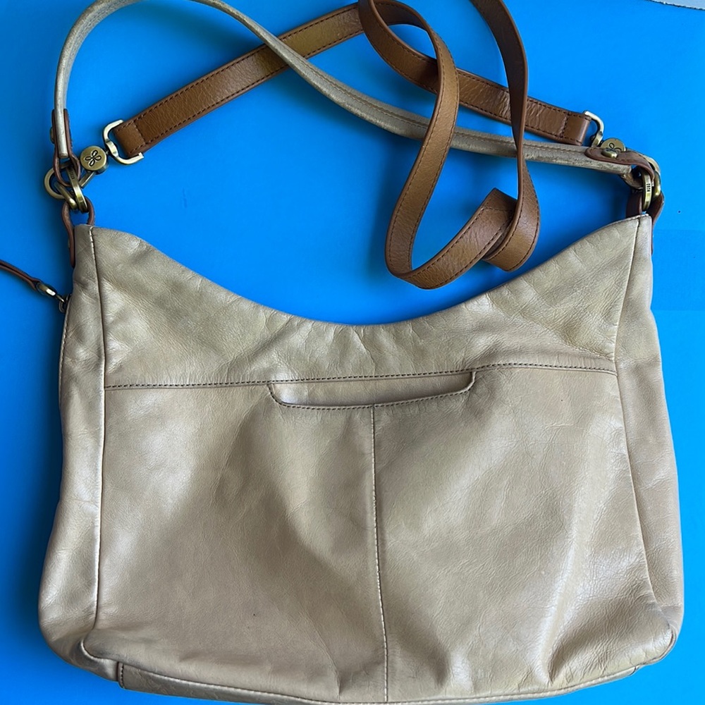 HOBO tan 8x14 crossbody purse that can also be a shoulder bag.